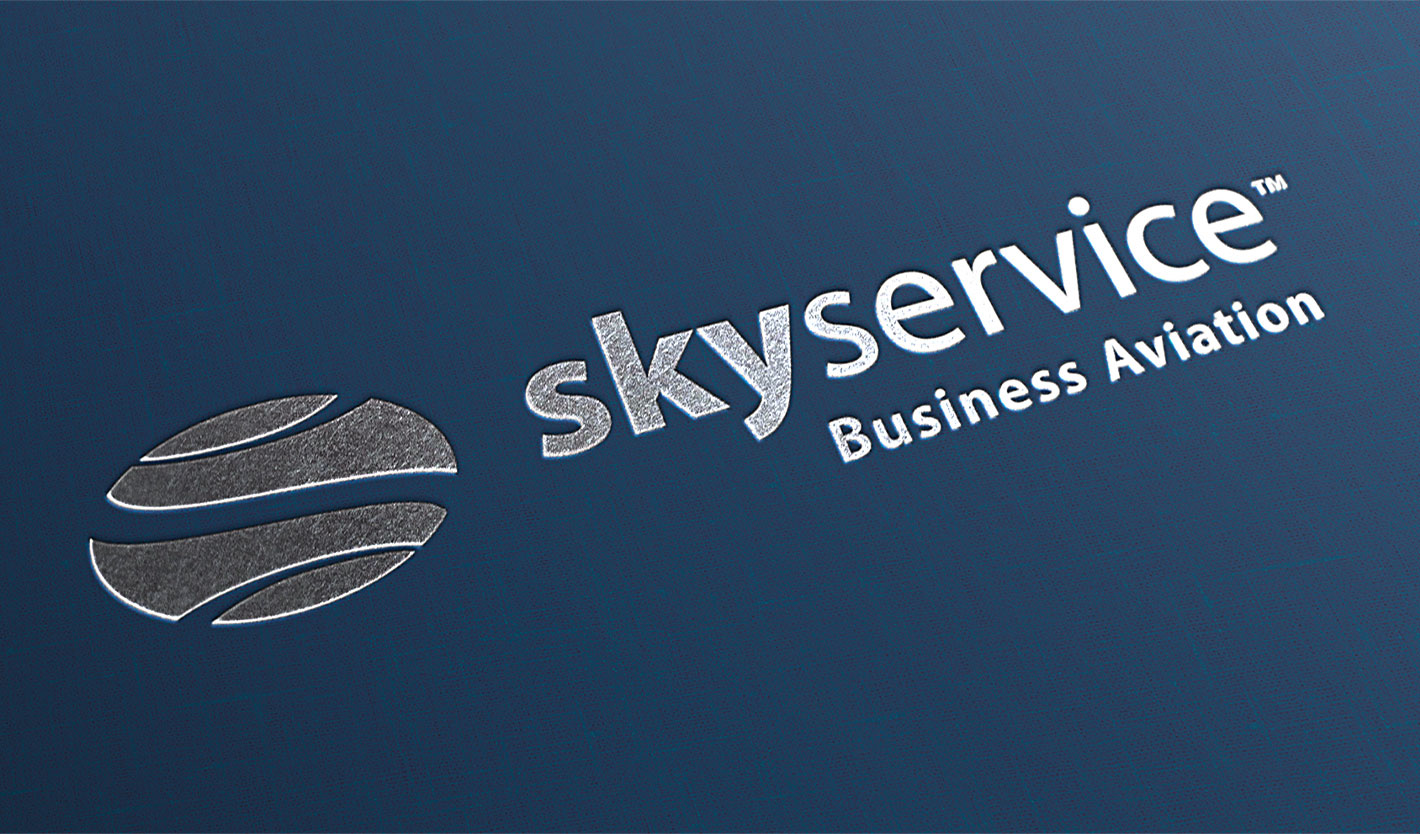 Close-up image of Skyservice pocketfolder with linen paper stock and silver foil application