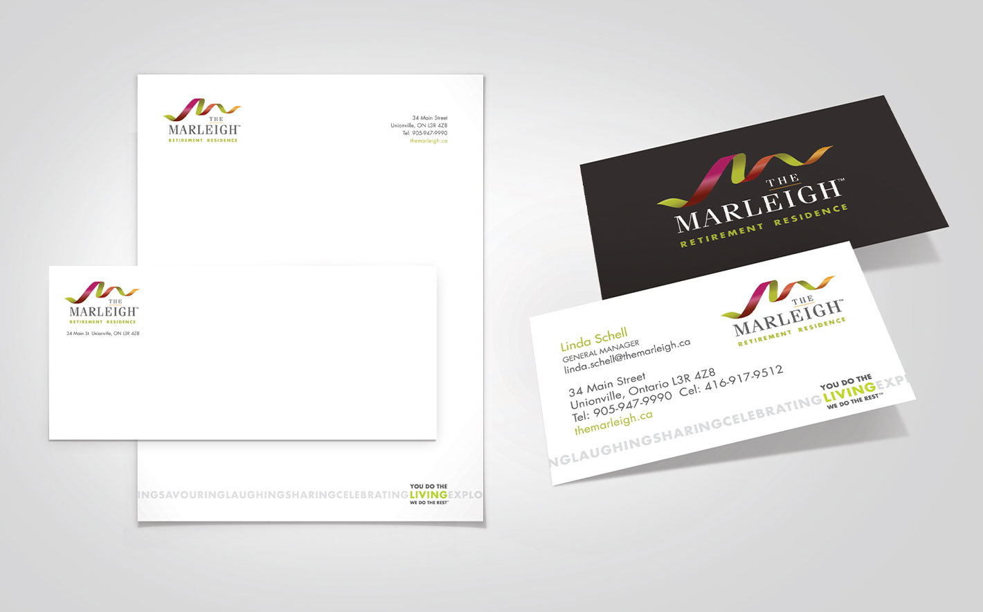 The Marleigh letterhead, envelope and business cards laid out on a table